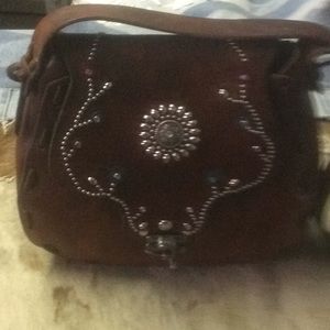 Vintage tooled leather bag studded